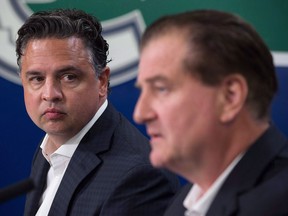 Vancouver Canucks' head coach Travis Green, left, and GM Jim Benning told reporters on Thursday they have no specifics for why president Trevor Linden left the NHL team, but both said the club is on the same page going forward.