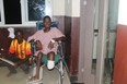 A patient in a hospital in Liberia uses a wheelchair donated by British Columbians and shipped to West Africa by the Korle-Bu charity.