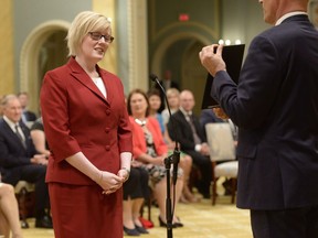 Carla Qualtrough is sworn in as Minister of Public Works and Procurement during a ceremony at Rideau Hall in Ottawa on Aug. 28, 2017. After being the minister of sport and persons with disabilities — a natural fit for a legally blind, human-rights lawyer who won three medals for swimming at the 1988 Seoul and 1992 Barcelona Paralympic Games — Qualtrough, 45, has taken on a bigger role, this time as minister for public services and procurement.