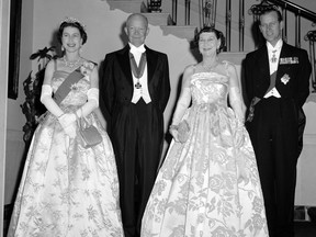 FILE - In this file photo dated Oct. 17, 1957, President Dwight Eisenhower, second left and first lady Mamie, second right are flanked by their royal guests, Britain's Queen Elizabeth II and her husband, Prince Philip, at the White House, in Washington. US President Trump enjoys flouting diplomatic rules and expressing himself in bold and sometimes mocking tweets and comments, but that side of his personality is unlikely to surface when he takes tea Friday, July 13, 2018 with Queen Elizabeth II. The president and his wife Melania are not expected to make waves during the visit with the 92-year-old monarch, who has met every U.S. president since Dwight Eisenhower with the exception of Lyndon Johnson, who never visited Britain while in office.