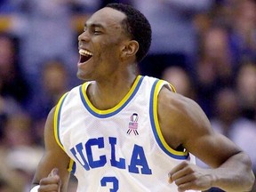 FILE - In this Dec. 29, 2001, file photo, UCLA's Billy Knight celebrates after scoring his second 3-point basket against Georgetown during the first half of an NCAA college basketball game in Los Angeles. Knight has died in Phoenix and the Maricopa County Medical Examiner's Office is trying to determine the cause of death. Phoenix police say Knight's body was found on a roadway early Sunday, July 8, 2018, near the downtown area and there was no evidence of foul play. The 39-year-old Knight was a guard/forward at UCLA from 1998-2002, averaging 14.1 points and 3.5 rebounds per game as a senior.