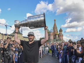 Washington Capitals captain Alex Ovechkin hoists the Stanley Cup in front of the famous Saint Basil's Cathedral in Red Square as he tours Moscow, his hometown, with the Stanley Cup.