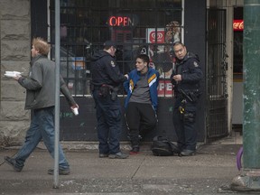 VPD members on E. Hastings Street in Vancouver's Downtown Eastside Saturday, February 3, 2018.