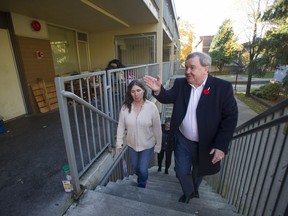 Poverty-reduction minister Shane Simpson tours Stamps Place, a low-income Vancouver housing project where he lived as a child, last October.