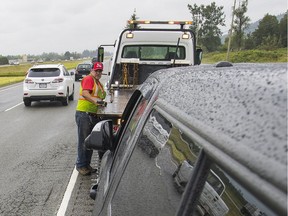 BCAA wants the B.C. government to improve safety for tow truck operators like Robert Guiboche by allowing them to use flashing lights when assisting motorists on roads and highways. (Francis Georgian/PNG FILES)