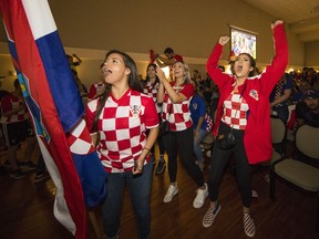 Vancouver soccer fans celebrate at the packed Croatian Cultural Centre on Saturday after their favourite World Cup team defeated host Russia.