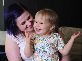 One-year-old Charlie Lock who has porphyria, meaning she is allergic to the sun, with her mother Bekah in Langley, BC. July 12, 2018.