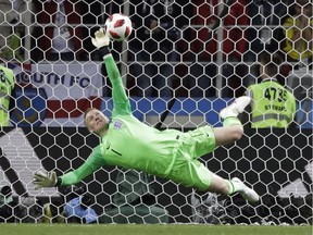 England goalkeeper Jordan Pickford makes The Save during the penalty segment in the Round of 16 World Cup match against Colombia in Moscow on July 3. England now plays Sweden in the quarterfinals.