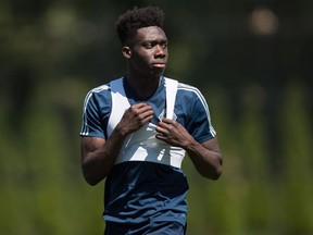 Vancouver Whitecaps midfielder Alphonso Davies leaves the field after MLS soccer team practice.
