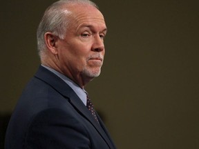 Premier John Horgan attends a press conference in the press theatre at Legislature in Victoria, B.C., on Tuesday May 29, 2018.