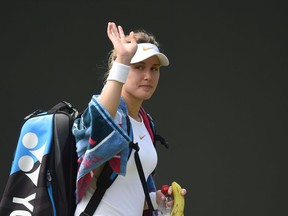 Eugenie Bouchard waves after losing to Ashleigh Barty at Wimbledon on July 5.