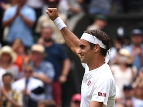 Roger Federer celebrates his win over Adrian Mannarino at Wimbledon on July 9.