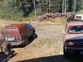 The fire came so close as the Hebb family, with the help of RCMP officers, loaded up belongings from their home that a fire retardant drop coated the vehicles.