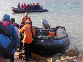 Loading into zodiacs at the beach.