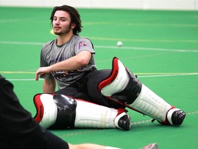 Goalie Christian Del Bianco, here stretching out while his National Lacrosse League Calgary Roughnecks practise in Calgary in December 2015, has been the undisputed star for the Coquitlam Junior Adanacs.