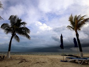 View of storm clouds on the beach in Cancun, Quintana Roo state, Mexico on October 6, 2017.