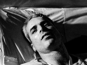 U.S. Navy Air Force Major John McCain lies in bed in a Hanoi hospital in 1967 as he was being given medical care for his injuries after his jet was shot down over North Vietnam that year.