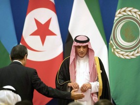 Saudi Arabia's Foreign Minister Adel al-Jubeir leaves the stage after speaking during the opening session of the 8th Ministerial Meeting of the China-Arab States Cooperation Forum in Beijing, Tuesday, July 10, 2018.