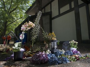 A memorial marks the spot outside the West Point Grey Community Centre in Vancouver where a woman died last month in a clothing donation bin.