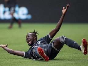 Vancouver Whitecaps' Kei Kamara reacts to the referee for a call after being knocked down by Toronto FC's Chris Mavinga, not shown, during first half Canadian Championship soccer final action in Vancouver on Wednesday, August 8, 2018.