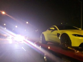 A yellow Aston Martin is hauled away after York Regional Police made a speeding arrest on Aug. 19, 2018 in Vaughan.