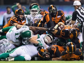 B.C. Lions' quarterback Cody Fajardo (17) is stopped by the Saskatchewan Roughriders defence on a third down play late in the second half of Saturday's game at B.C. Place.