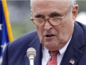 Rudy Giuliani, an attorney for President Donald Trump, addresses a gathering during a campaign event for Eddie Edwards, who is running for the U.S. Congress in New Hampshire, in Portsmouth, N.H., Wednesday, Aug. 1, 2018.