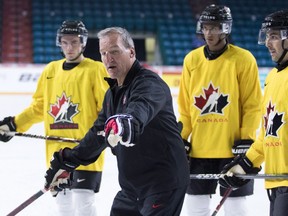 Canada Head Coach Tim Hunter gives some instructions during practice at the Sandman Centre in Kamloops.