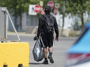 Jerome Messam leaves Mosaic Stadium on July 30 after being released by the Saskatchewan Roughriders, one day after being charged with voyeurism.