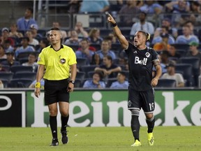 Vancouver Whitecaps' Erik Hurtado, right, celebrates his goal during the second half of an MLS soccer match against New York City FC, Saturday, Aug. 4, 2018, in New York.