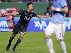 Vancouver Whitecaps' Nicolas Mezquida, left, celebrates his goal during the first half of last Saturday's MLS soccer match against New York City FC at Yankee Stadium. Mezquida had started four games this season, three on the road, and lost all of them. Saturday’s draw was his first win as a starter since a 1-0 decision over Sporting Kansas City last September.