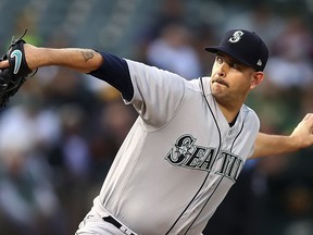 Seattle Mariners pitcher James Paxton works against the Oakland Athletics in the first inning of a baseball game Tuesday, Aug. 14, 2018, in Oakland, Calif.