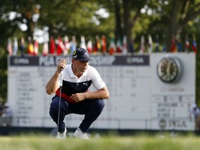 Gary Woodland looks at a putt on the 18th green during the first round of the PGA Championship golf tournament at Bellerive Country Club, Thursday, Aug. 9, 2018, in St. Louis.