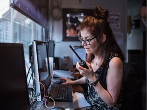 Stephanie Williams at work in the roof-top press box at Nat Bailey Stadium.