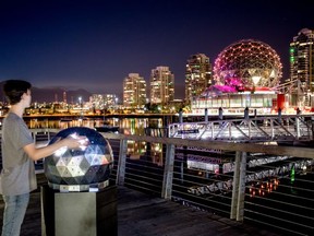 OH! Interactive Art Installation at Olympic Village allows visitors to control the lights on the iconic Science World dome.