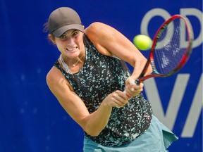 Canadian Rebecca Marino returns a ball to Naomi Broady of Great Britain during the Odlum Brown VanOpen at the Hollyburn Country Club in West Vancouver on Aug. 15.