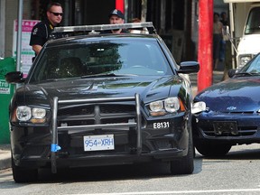 An officer suffered minor injuries when his police vehicle was hit near Main and Keefer streets in downtown Vancouver Wednesday.