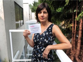 Ulrike Rodrigues, who is fighting an owner in her apartment building who she says has multiple Airbnb listings in contravention to city bylaws, in action in Vancouver, BC., August 22, 2018.