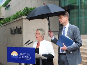 Attorney General David Eby and Judy Darcy, Minister of Mental Health and Addictions, at a press conference at B.C. Supreme Court in Vancouver on August 29, 2018. The province of B.C. has launched a class action lawsuit against opioid drug companies, whose marketing practices have had devastating impacts on the lives of thousands of British Columbians.