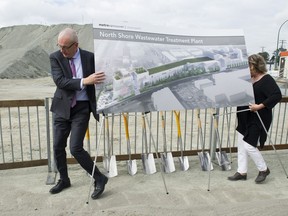 A drawing of the North Shore waste-water treatment plant is moved into position for a photo op after a briefing update on the plant in North Vancouver Friday.