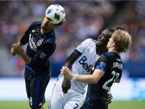 San Jose Earthquakes' Chris Wondolowski, left, gets his head on the ball as Vancouver Whitecaps' Kei Kamara, centre, and San Jose's Florian Jungwirth watch during the teams' 2-2 draw at B.C. Place in May. Wondolowski and Kamara are the two active leading goal-scorers in MLS history.