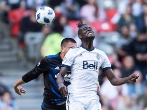 Vancouver Whitecaps' Kei Kamara, front, and San Jose Earthquakes' Jimmy Ockford battle for the ball during first half MLS soccer action in Vancouver on Wednesday May 16, 2018.The Vancouver Whitecaps know the San Jose Earthquakes will be seeking revenge when they visit B.C. this weekend, and they know there's work to be done to successfully defend the home turf.