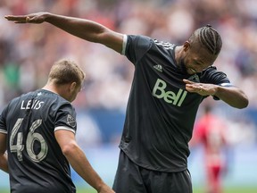 Vancouver Whitecaps' Kendall Waston, right, and Brett Levis celebrate Waston's second goal against the New York Red Bulls during the second half of last week's game at B.C. Place.