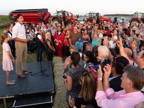 Prime Minister Justin Trudeau addresses local Liberals and Liberal MPs from the South Shore of Montreal for a summer corn roast in Sabrevois, Que., on Thursday, Aug. 16, 2018.