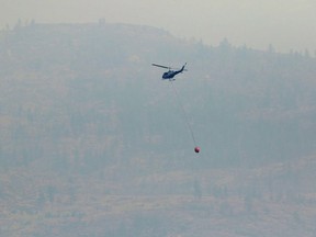 Helicopter evacuations were needed for at least four families near Quesnel on Saturday when the wildfire cut off access to a forestry service road.