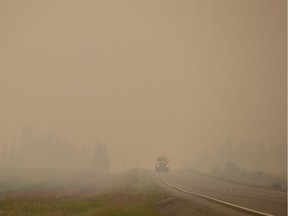 Thick smoke from wildfires fills the air as a motorist travels on Highway 27 between Vanderhoof and Fort St. Jameson Wednesday.