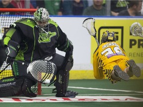 National Lacrosse League netminder Aaron Bold, shown here making a save on Georgia Swarm forward Shayne Jackson last year, has signed on with Vancouver for the upcoming season.