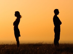 Silhouette of an angry couple.