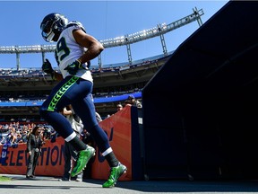 Wide receiver Doug Baldwin takes the field for the Seattle Seahawks before a game against the Denver Broncos at Broncos Stadium at Mile High on Sept. 9. He was injured in the game and has missed two contests.