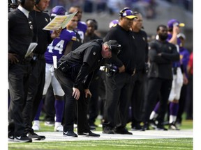 Minnesota Vikings head coach Mike Zimmer slumps over on the sideline during the fourth quarter of their game against the heavily underdog Buffalo Bills at U.S. Bank Stadium in Minneapolis, Minn., on Sept. 23, 2018. The Vikings took a 27-6 pounding from the Bills.